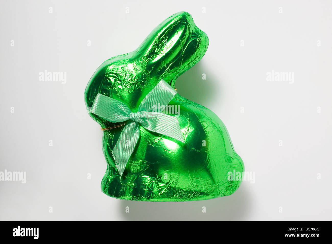 Chocolate bunny in green foil - Stock Photo
