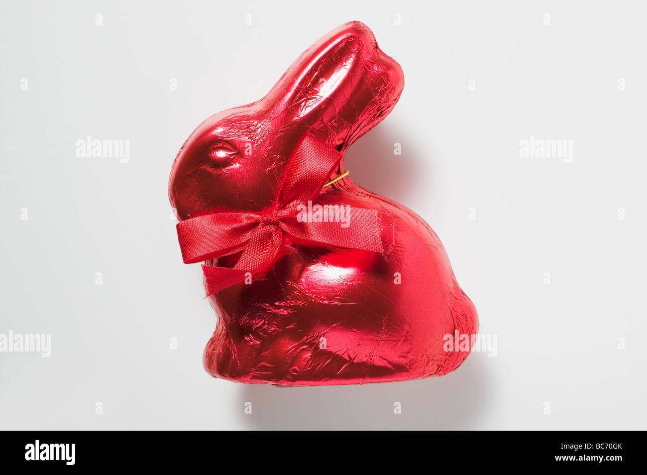 Chocolate bunny in red foil - Stock Photo