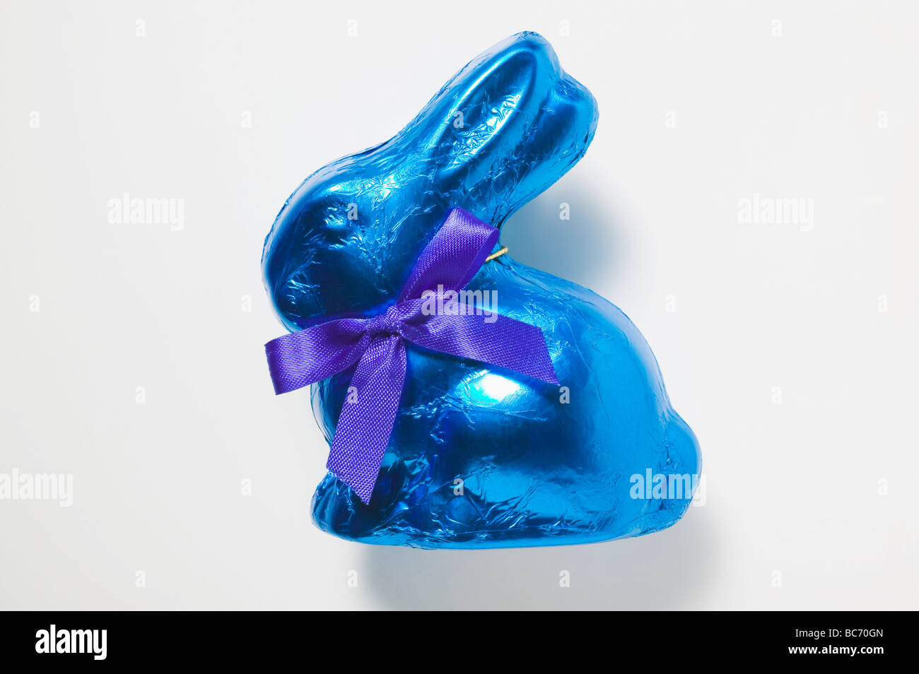 Chocolate bunny in blue foil - Stock Photo