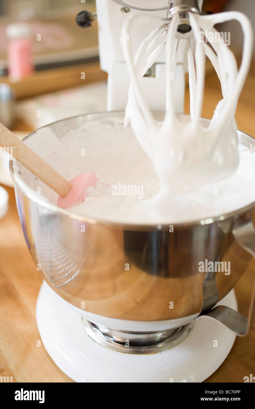 Whipped cream in the mixing bowl of a food mixer Stock Photo Alamy
