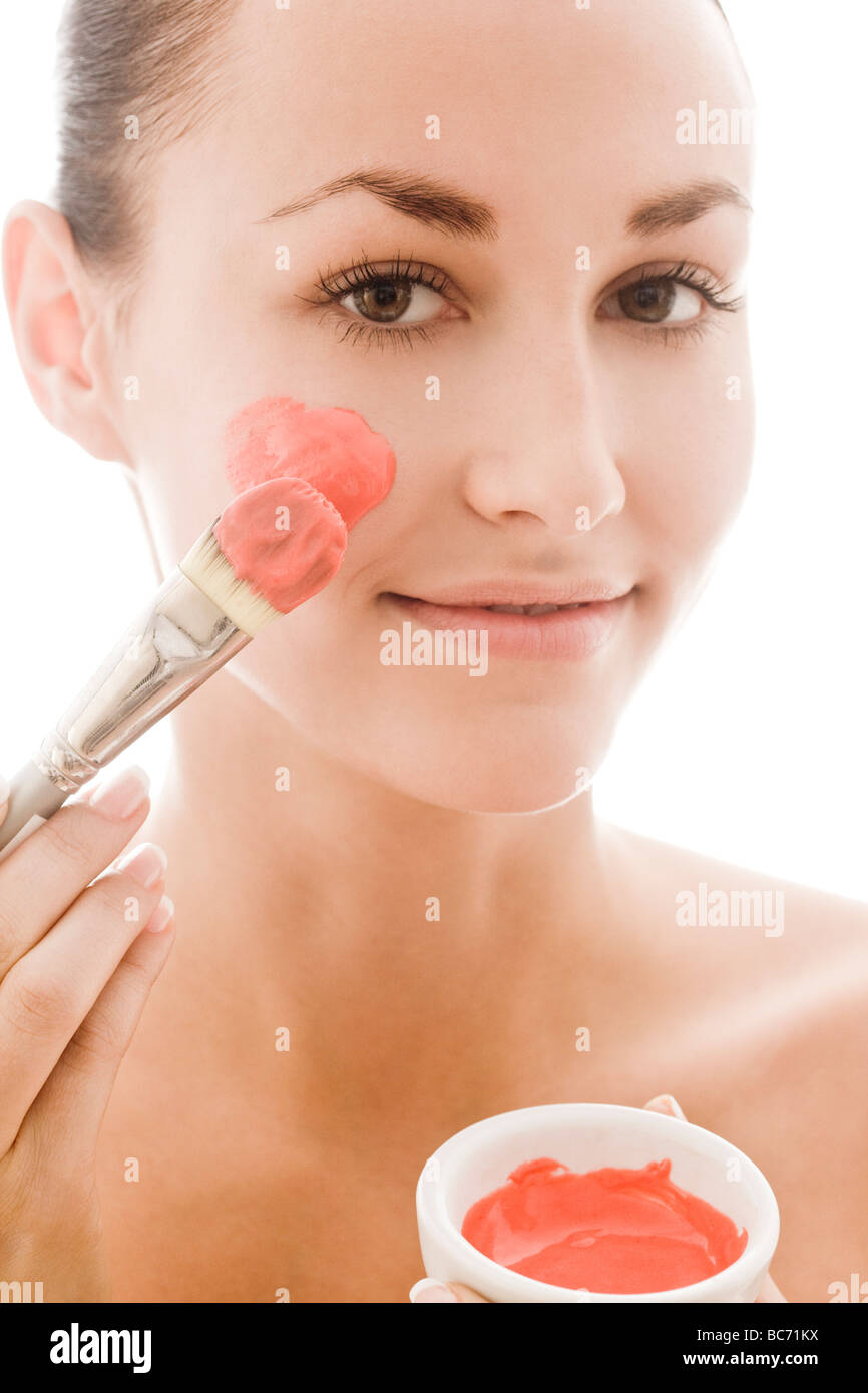 woman applying facial mask Stock Photo - Alamy
