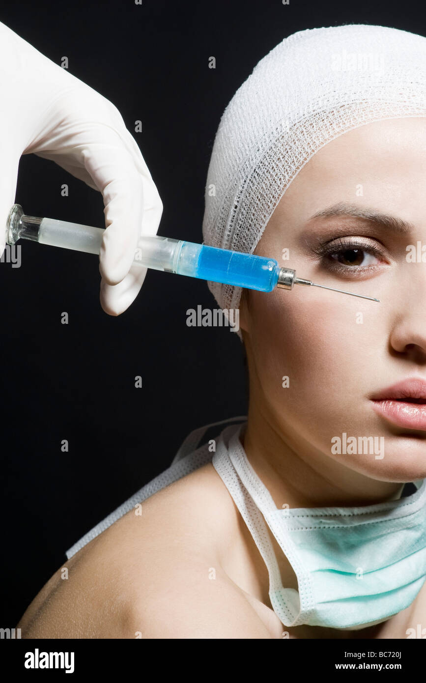 woman receiving bot ox injection Stock Photo - Alamy