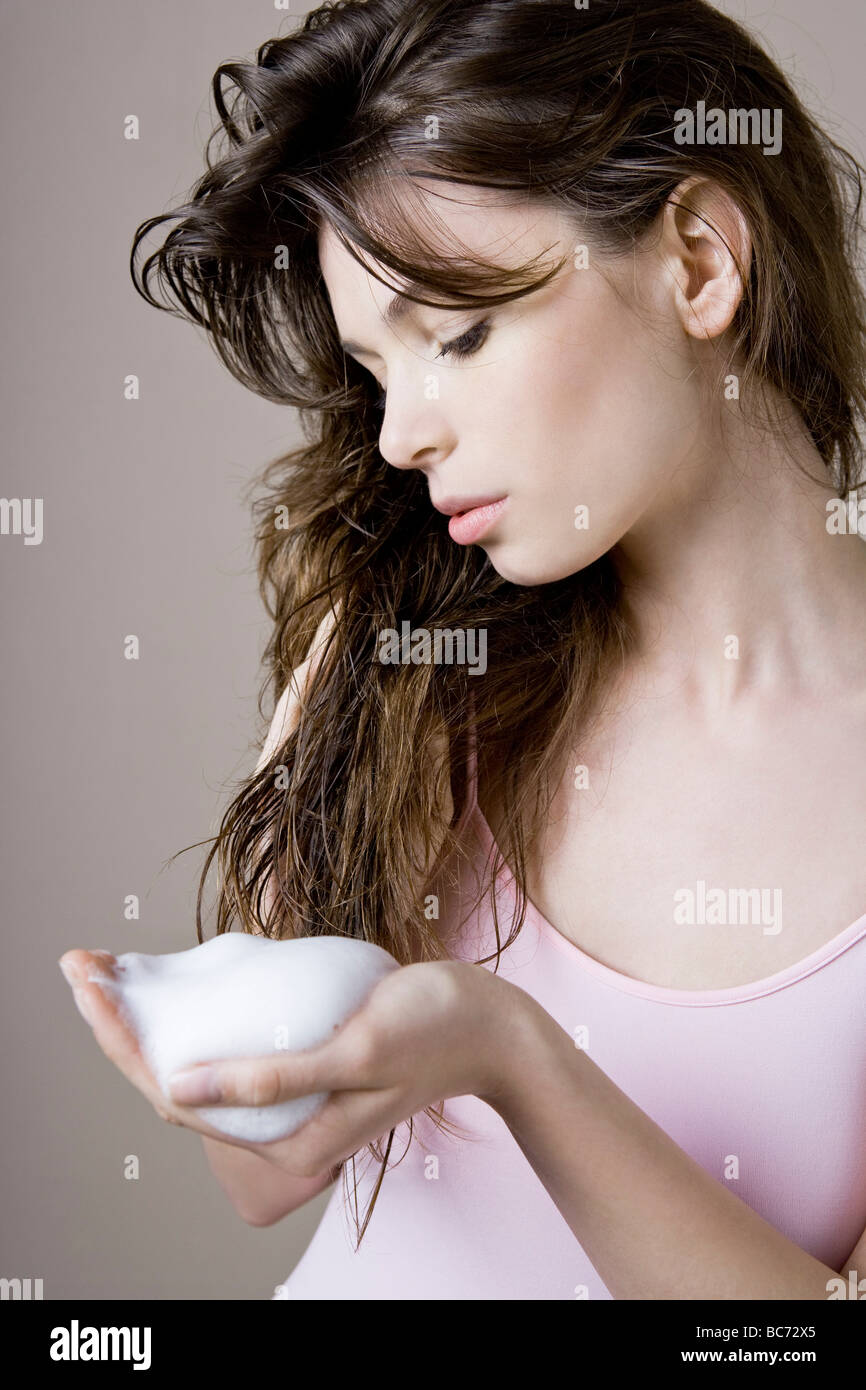 woman with styling mousse Stock Photo - Alamy
