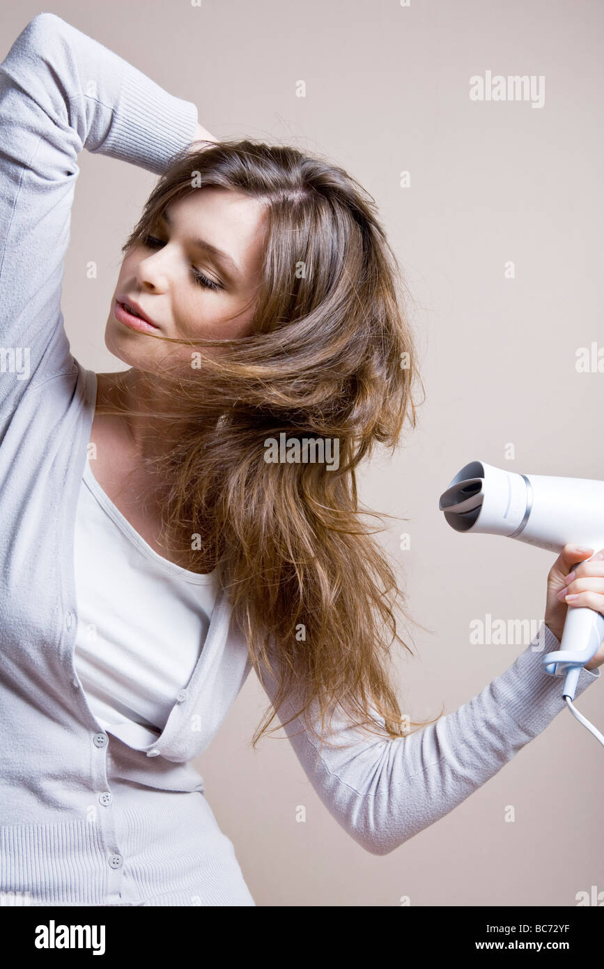woman drying hair Stock Photo Alamy