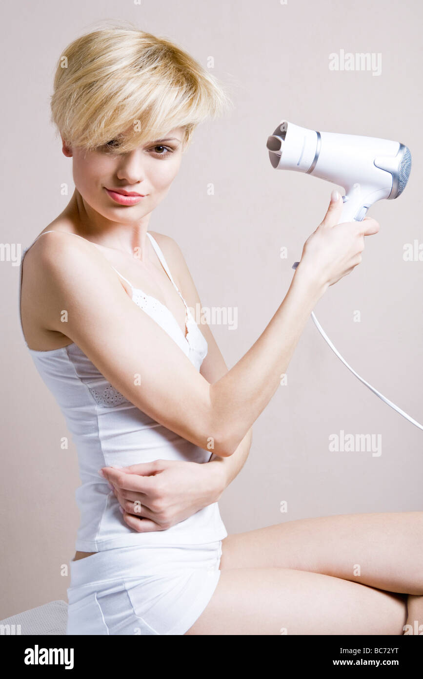 Hair blonde blow dry hi-res stock photography and images - Alamy
