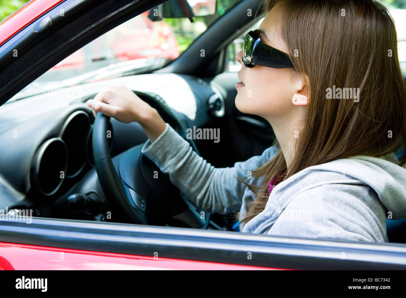 woman in sunglasses driving car Stock Photo Alamy