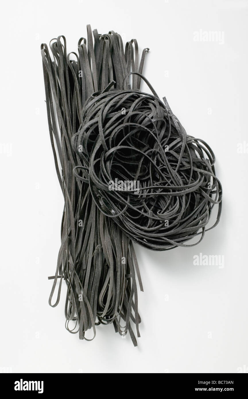 Black ribbon pasta Stock Photo - Alamy