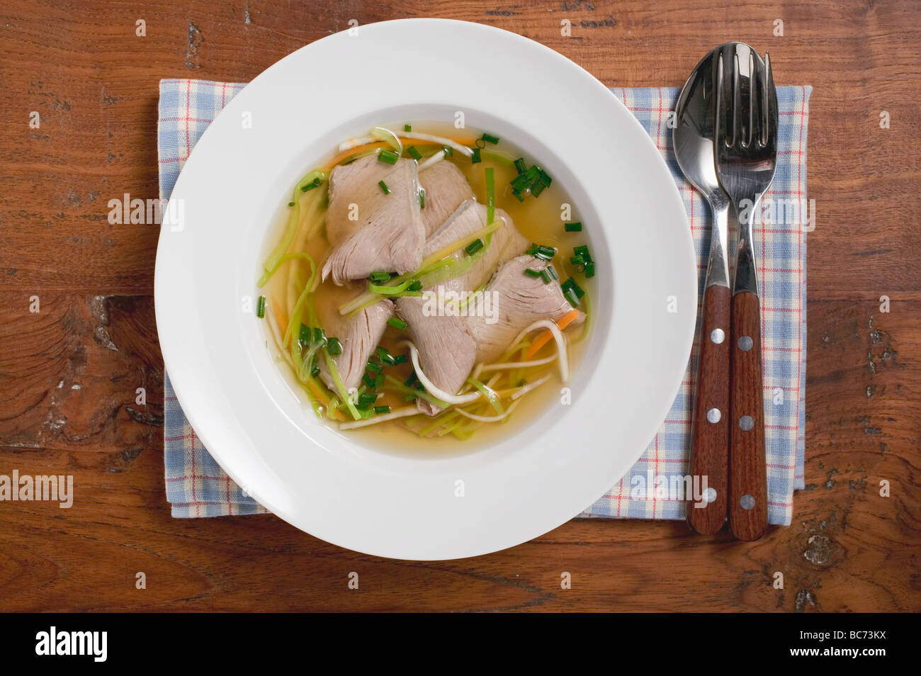 Clear broth with beef - Stock Photo