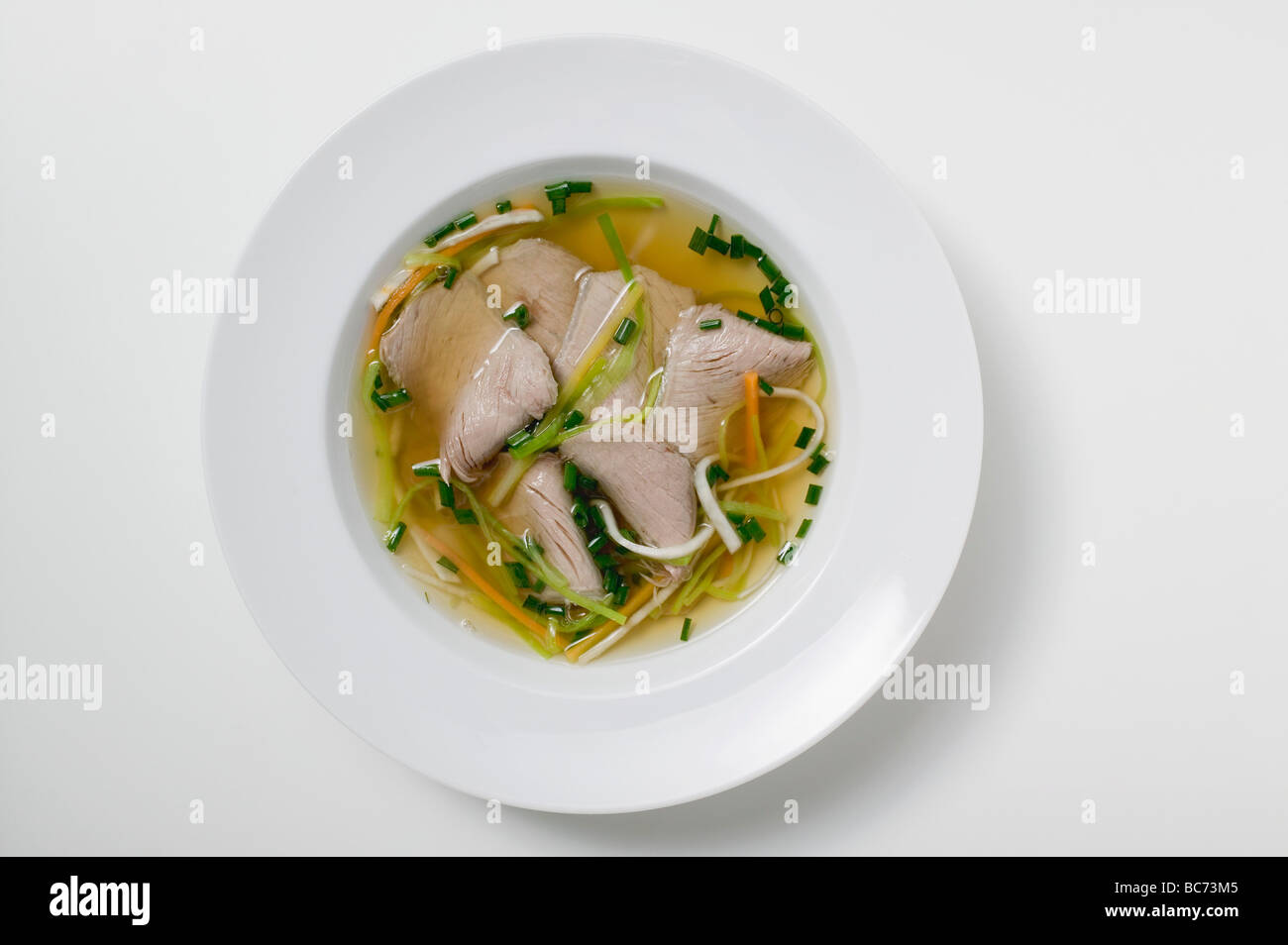 Clear broth with beef - Stock Photo