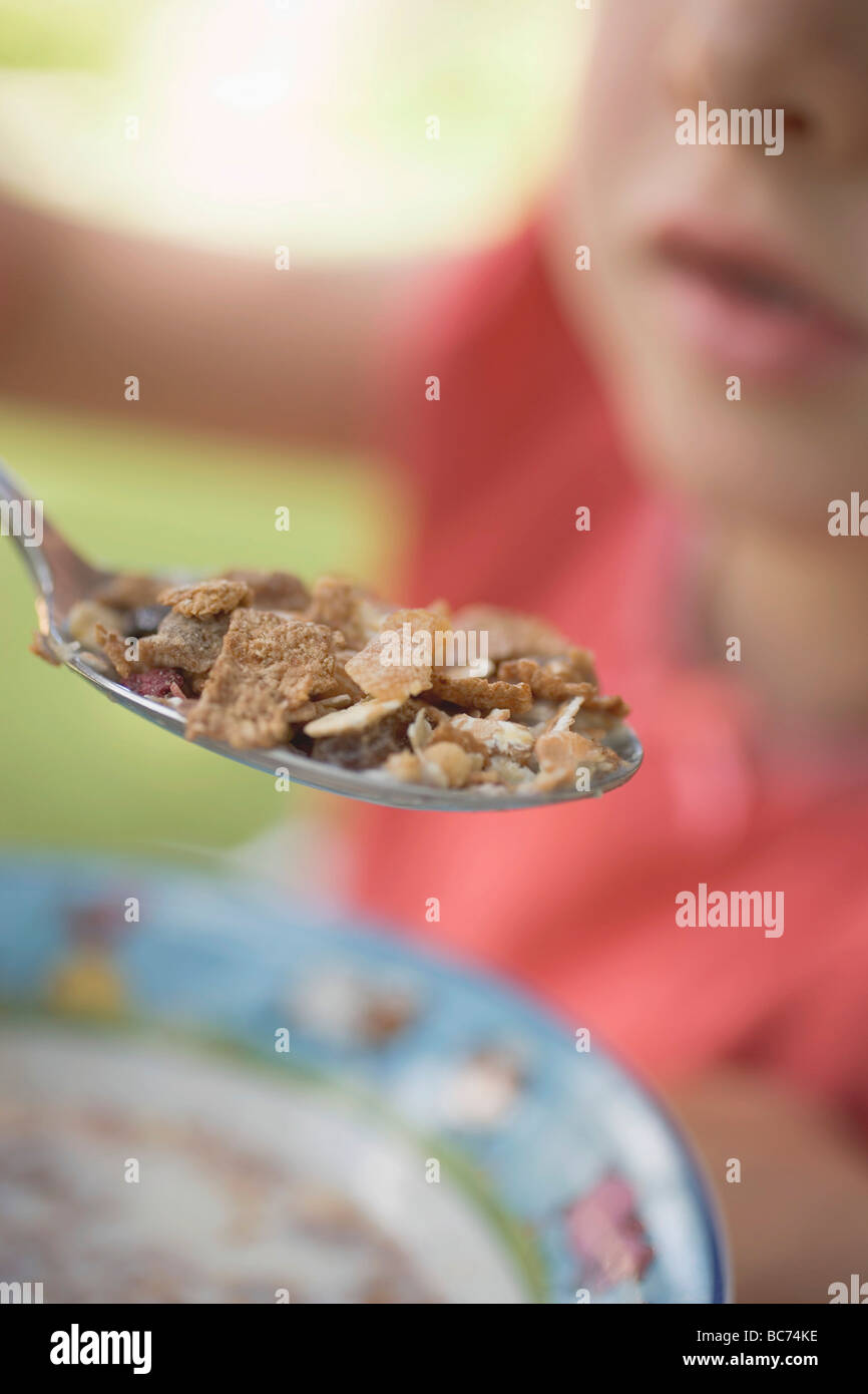 Child eating cereal Stock Photo - Alamy