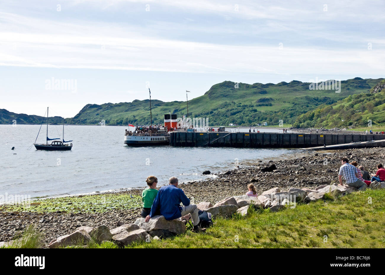 The village of Inverie pier in Inverie Bay Loch Nevis on Knoydart the West Highlands of Scotland with paddle steamer Waverley Stock Photo