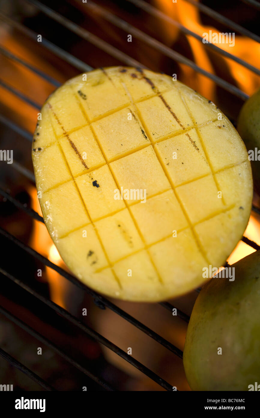 Mango on barbecue grill rack Stock Photo Alamy