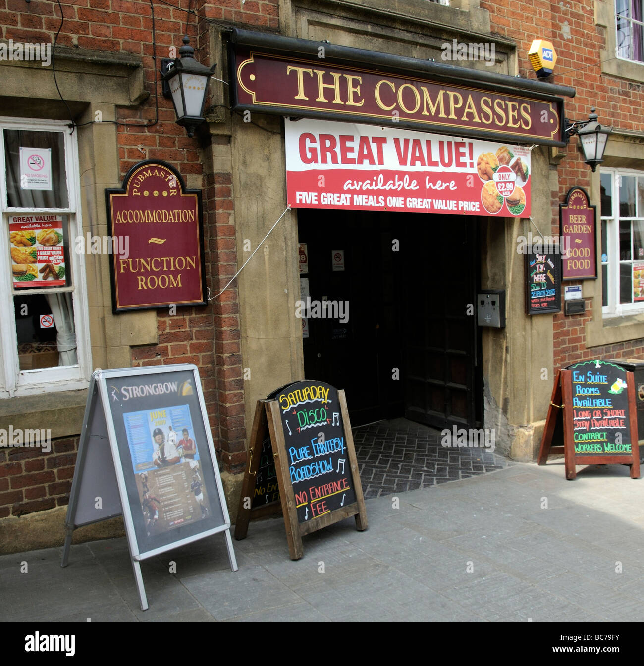Pub advertising boards signs and banner outside the Compasses public
