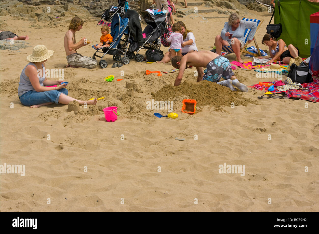 A Family Enjoying A Day At The Seaside Family On The Beach UK Beaches Stock Photo