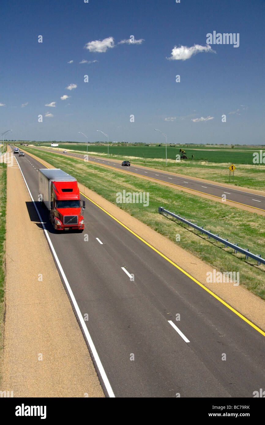Long haul truck traveling on Interstate 70 in Russell County Kansas USA  Stock Photo