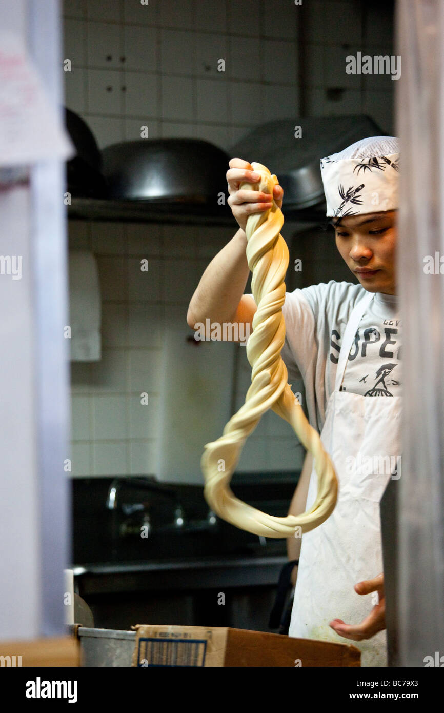 Making Handmade Noodles in a Noodle Shop in Chinatown New York CIty
