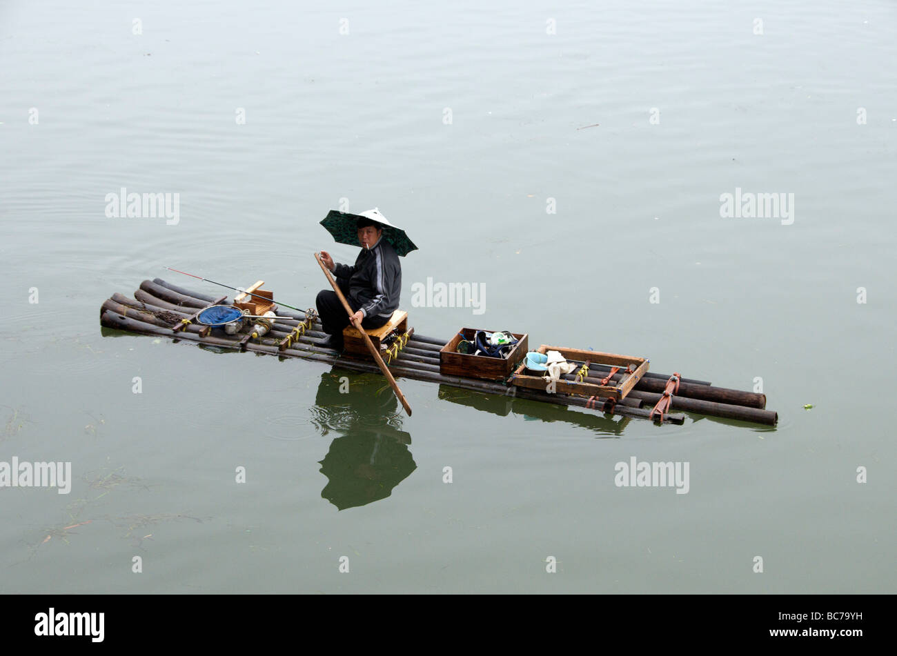 Fisherman on bamboo raft Li River Guilin Guangxi China Stock Photo - Alamy
