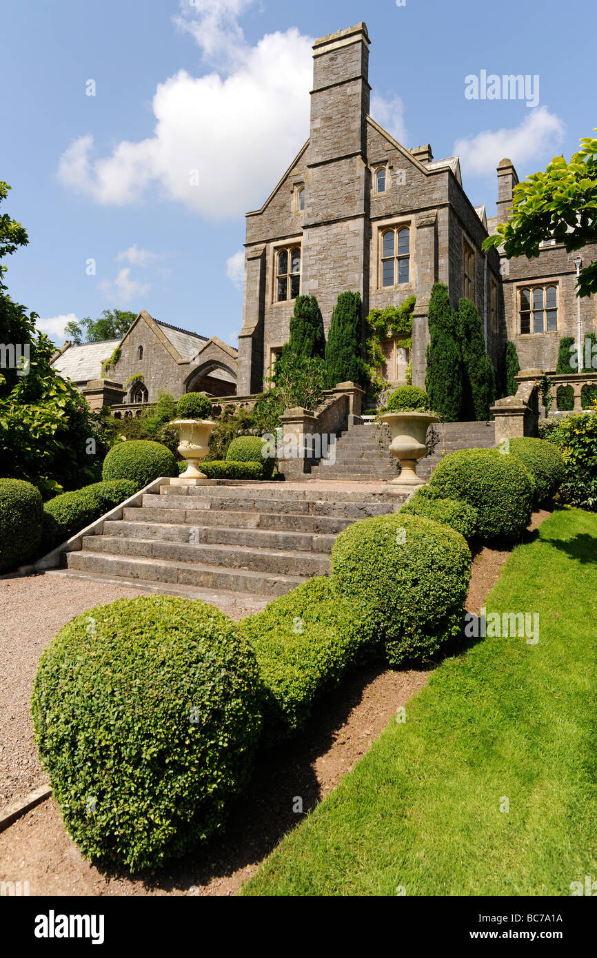 Court stately home or manor house with landscaped garden in