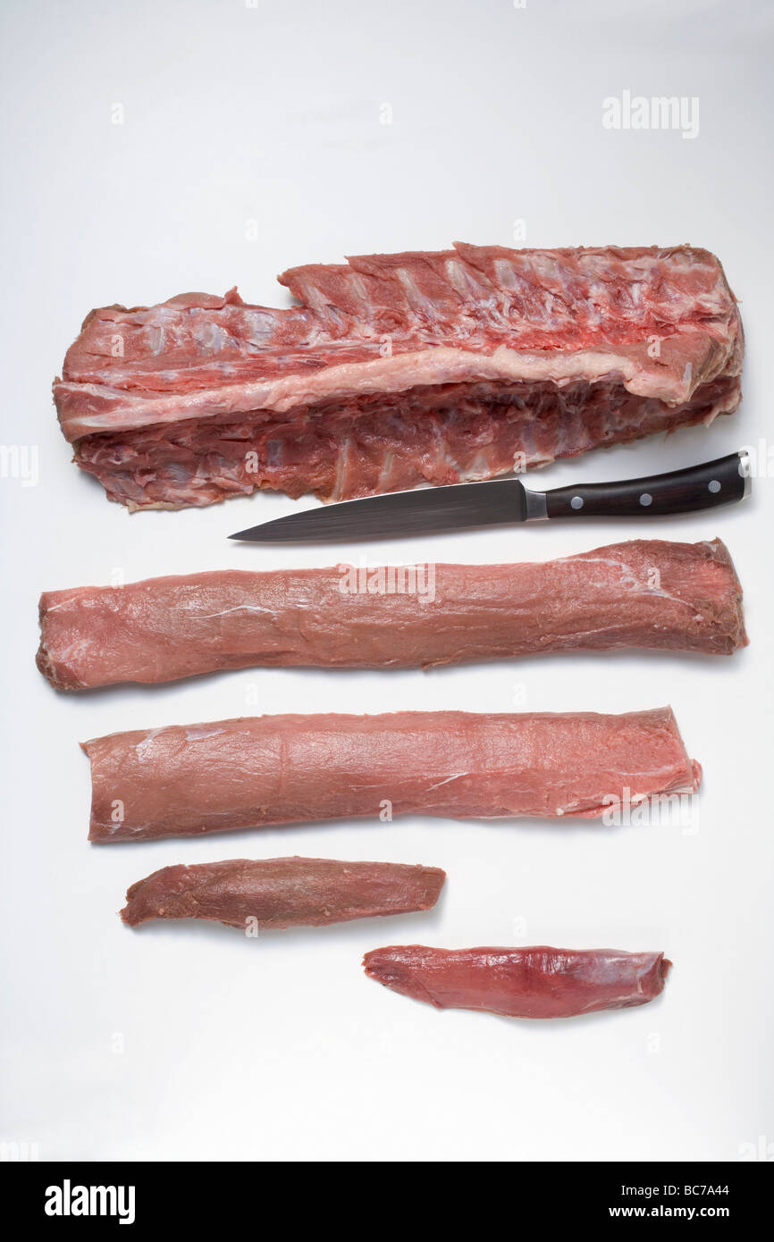 Raw pork fillets, ribs and chine bone - Stock Photo