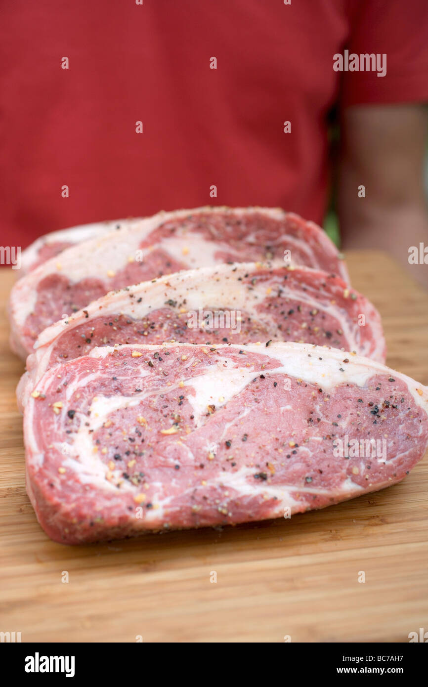 Raw meat being seasoned hires stock photography and images Alamy