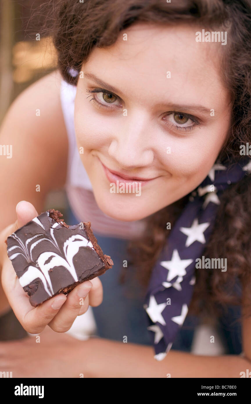Hand holding brownie hi-res stock photography and images - Alamy