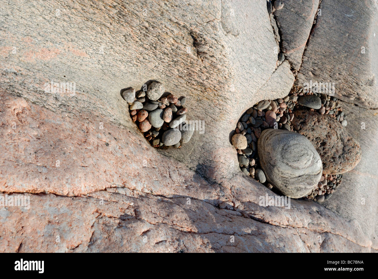 The pebbles and rocks of the rocky islands in the Porvoo Archipelago on a warm summer day, Porvoo, Finland, Europe. Stock Photo