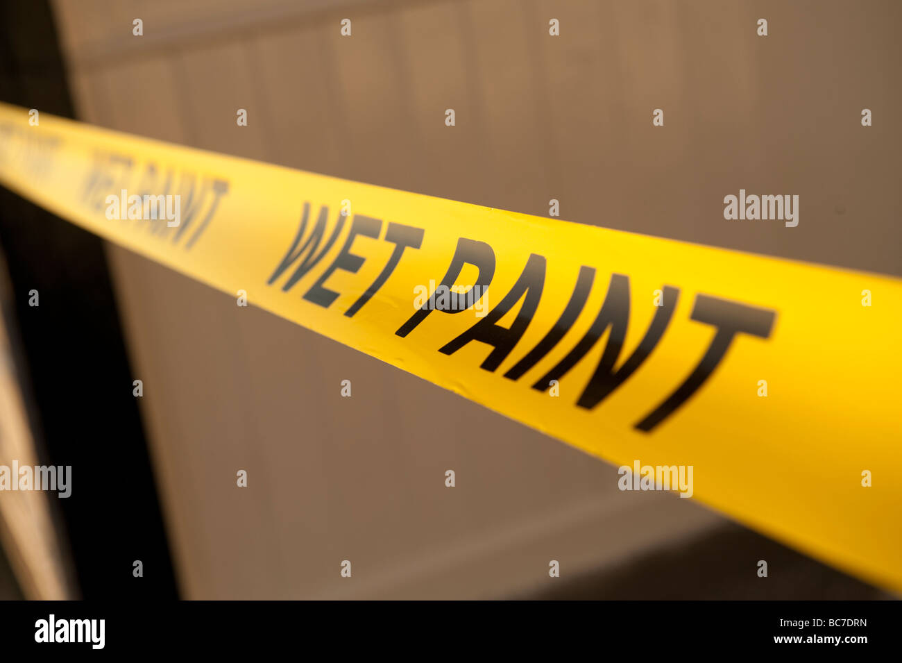 yellow wet paint warning tape Stock Photo Alamy