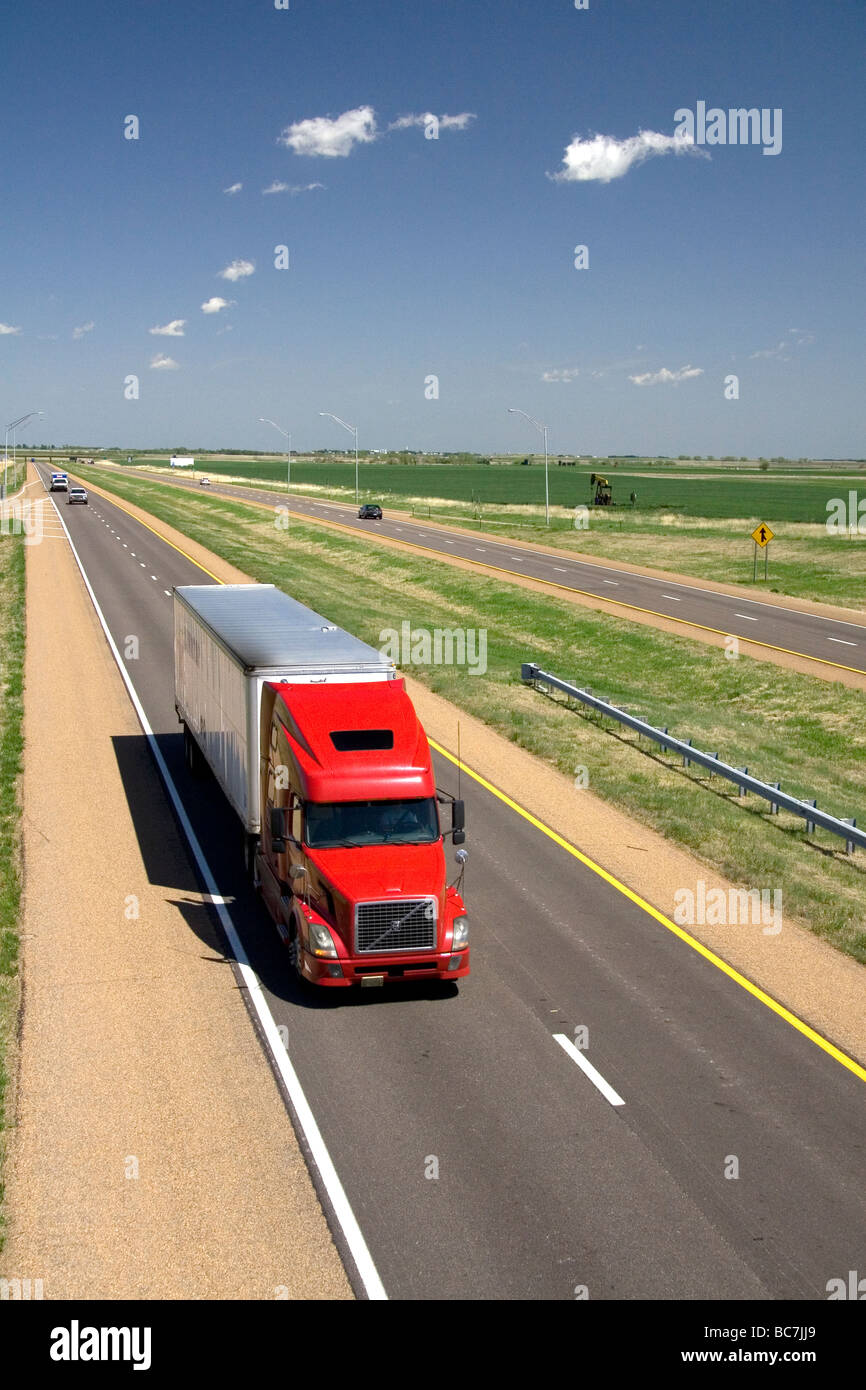 Long haul truck traveling on Interstate 70 in Russell County Kansas USA  Stock Photo