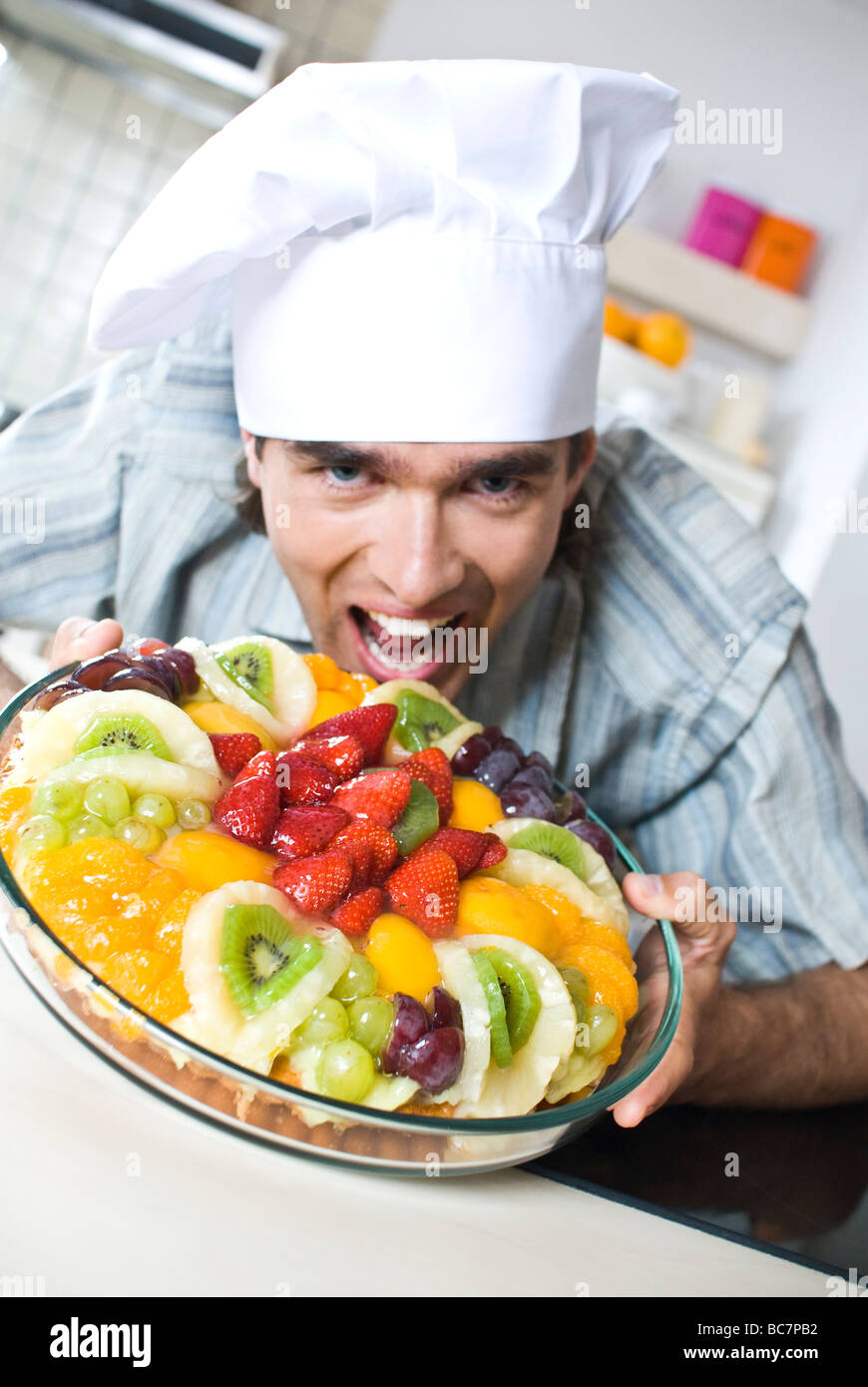 man with fruit cake Stock Photo Alamy