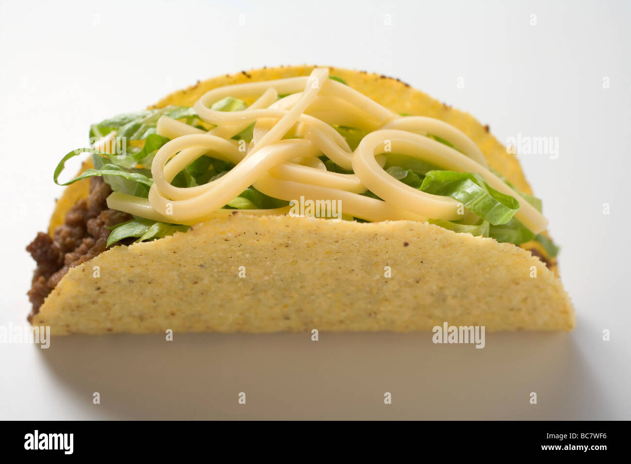Taco filled with mince, lettuce and cheese Stock Photo Alamy