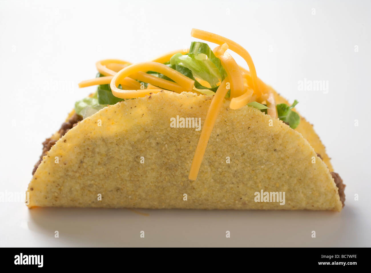 Taco filled with mince, lettuce and cheese Stock Photo Alamy