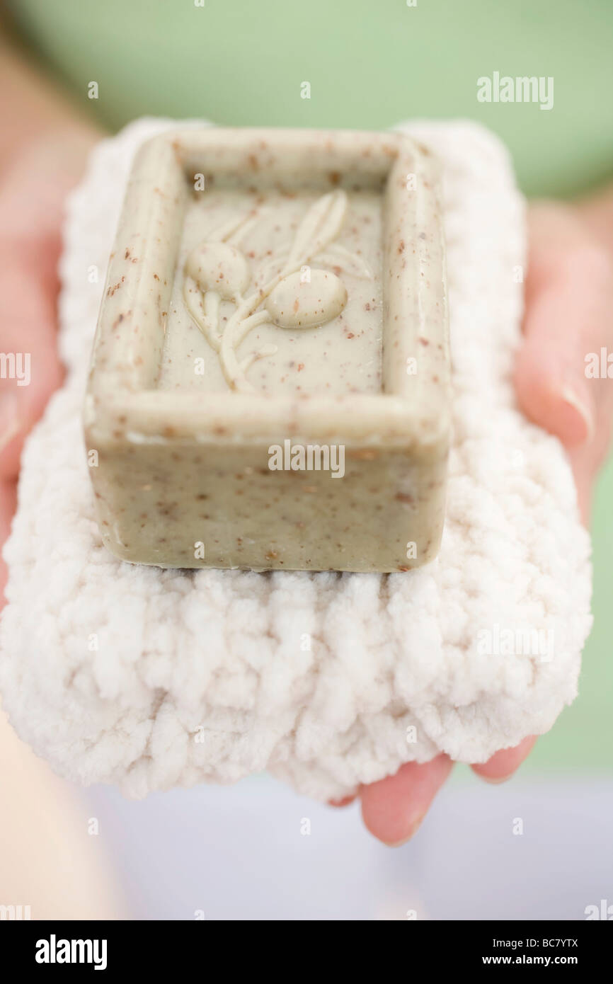 Woman holding olive soap hi-res stock photography and images - Alamy