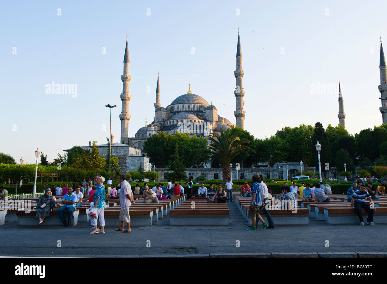 Turkey , Istanbul , the Blue Mosque or Sultan Ahmet Camii , from Sultanahmet Square or Meydani , at sunset or dusk with crowds Stock Photo