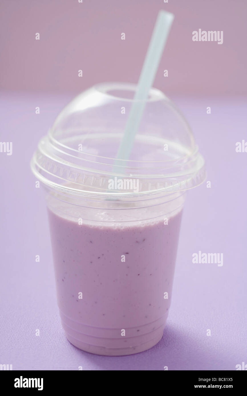 Blueberry shake in plastic cup with straw Stock Photo Alamy