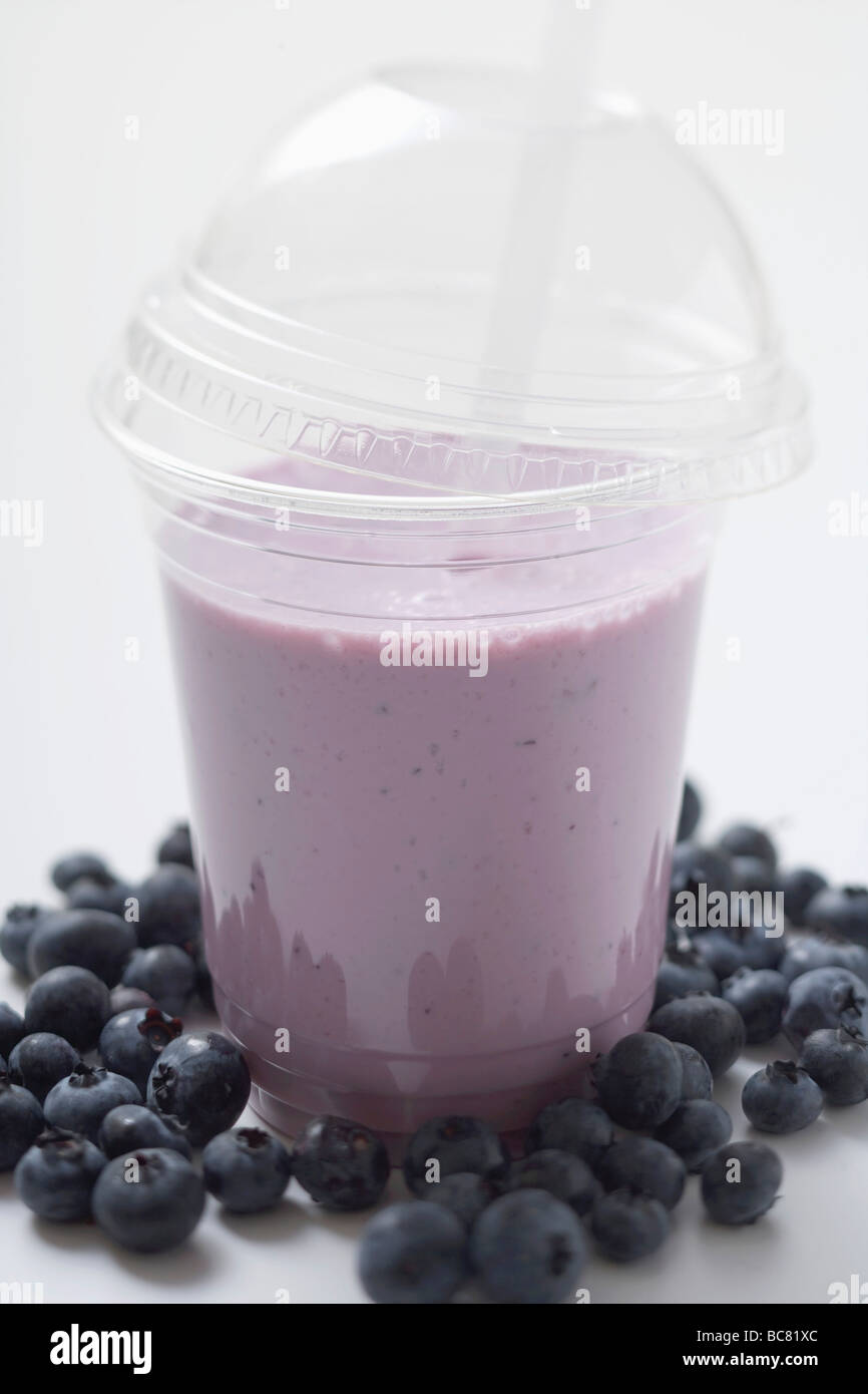 Blueberry shake in plastic cup, surrounded by blueberries Stock Photo Alamy