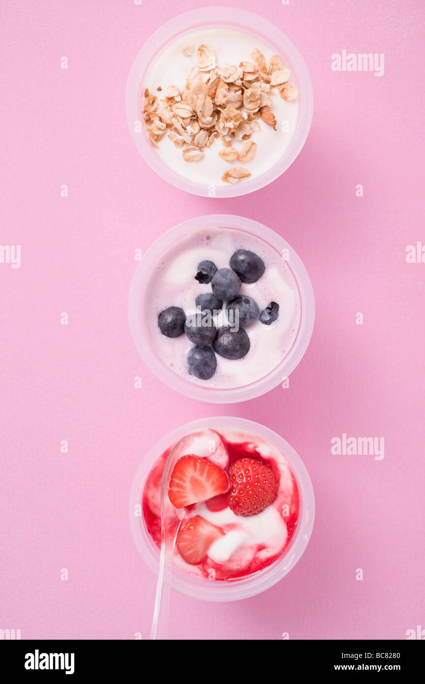 Strawberry yoghurt, blueberry yoghurt & yoghurt with cereal Stock Photo