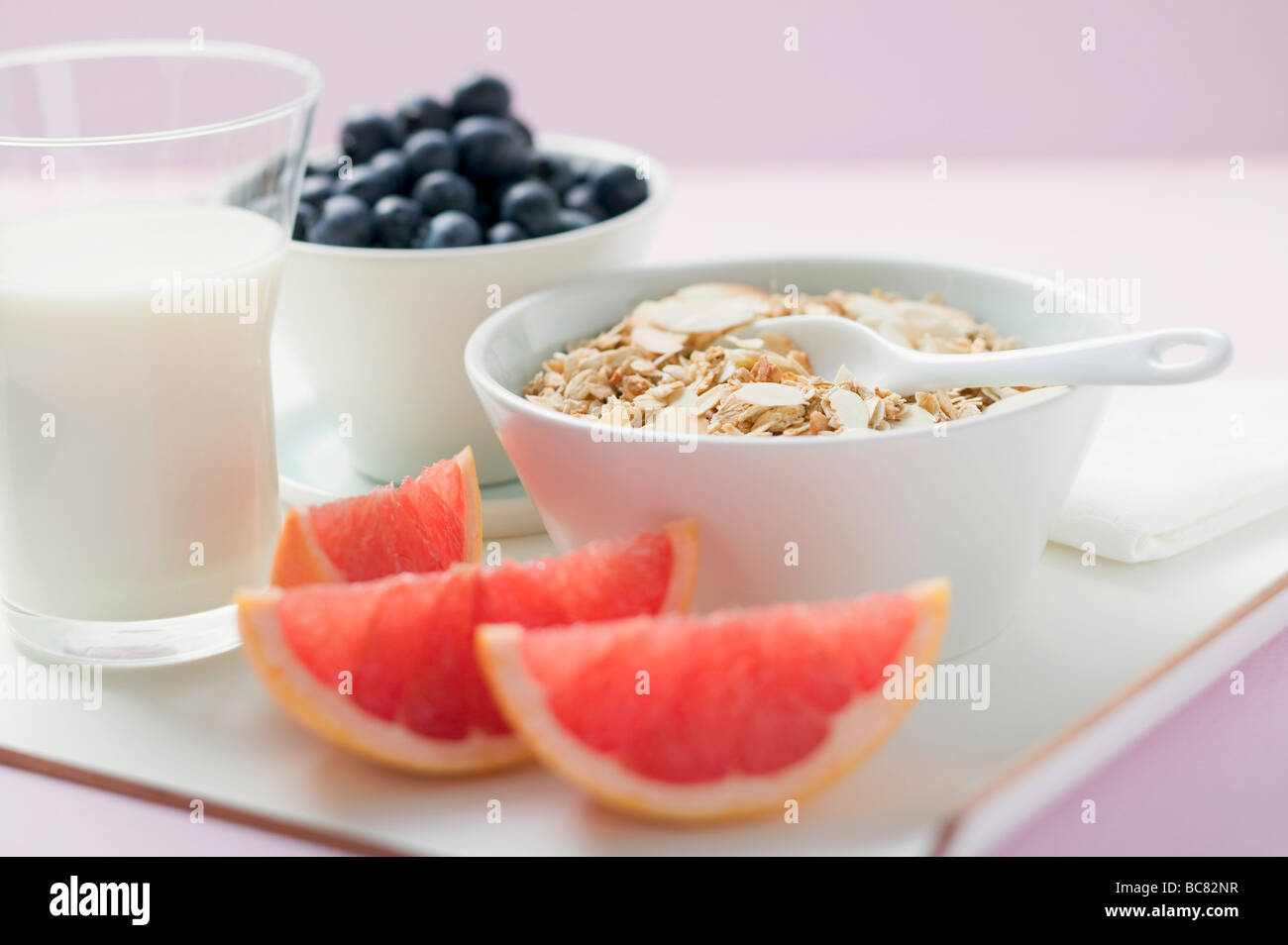 Muesli ingredients cereal, yoghurt, blueberries, grapefruit Stock