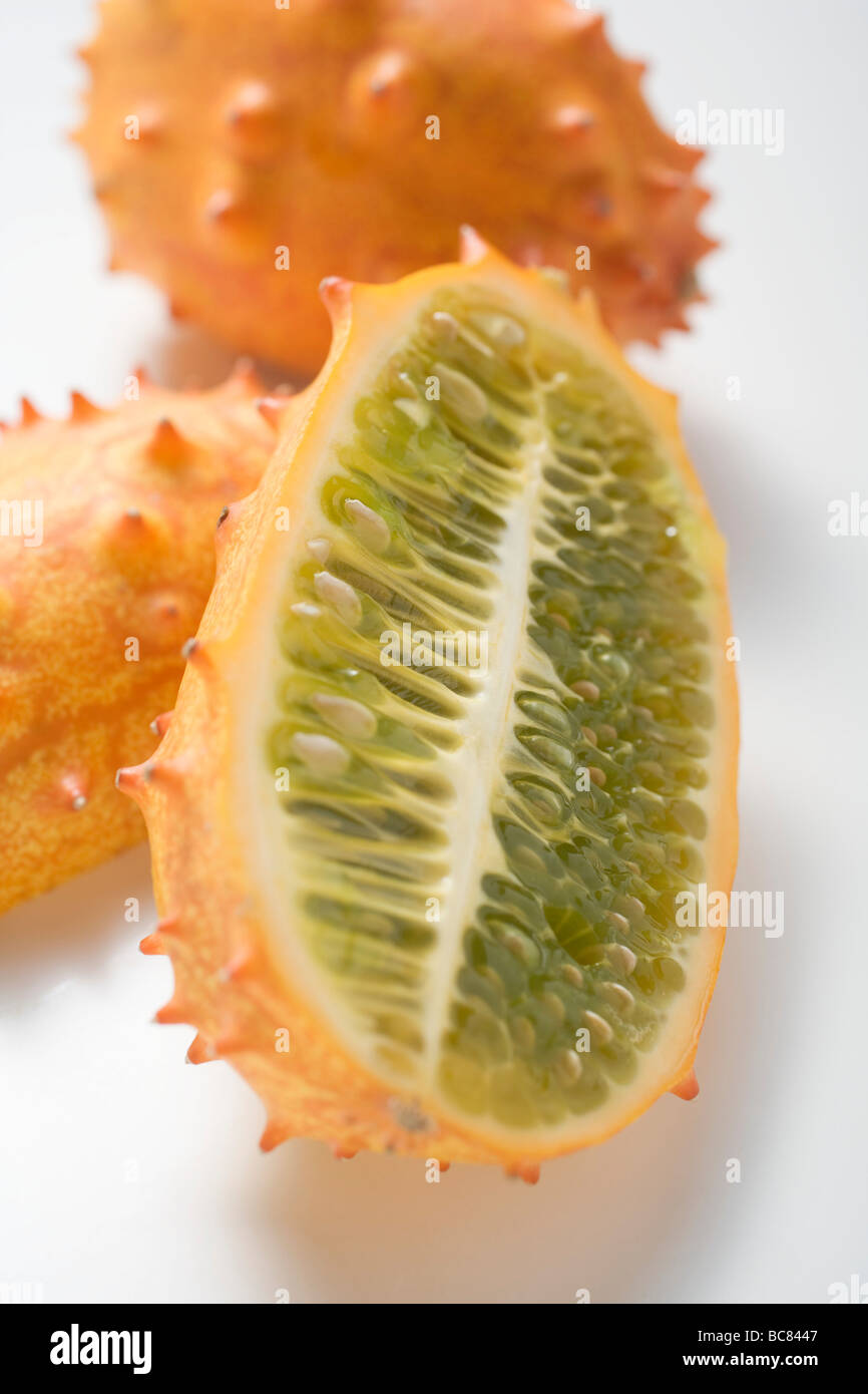 Kiwanos (horned melons), whole and halved Stock Photo Alamy