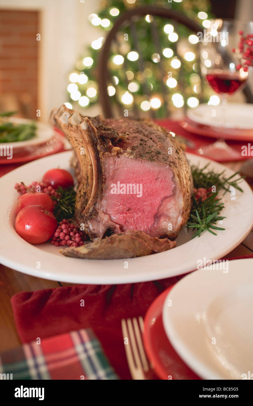 Roast rib of beef on Christmas table Stock Photo Alamy