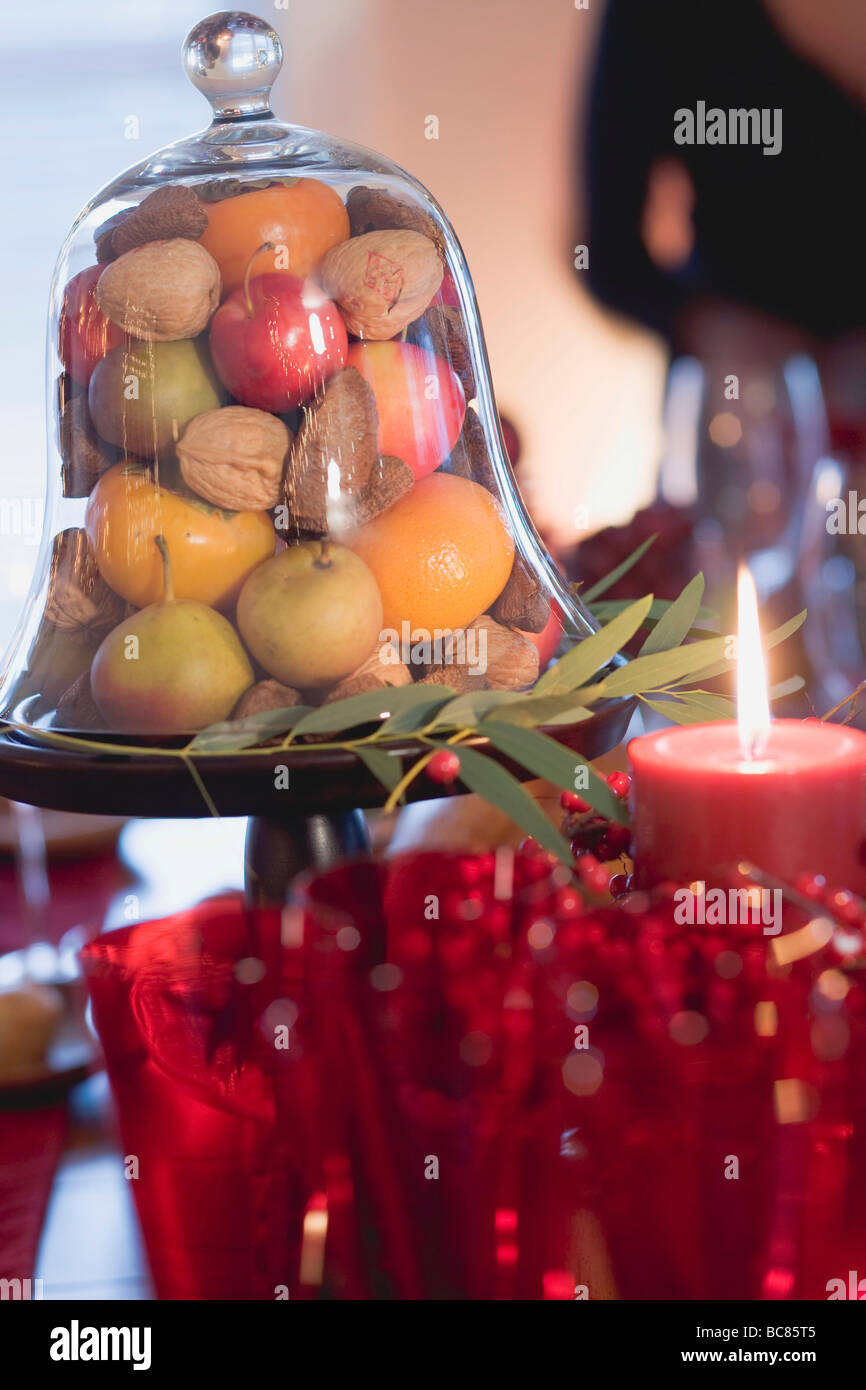 Fruit and nuts under glass dome (Christmas) - Stock Photo