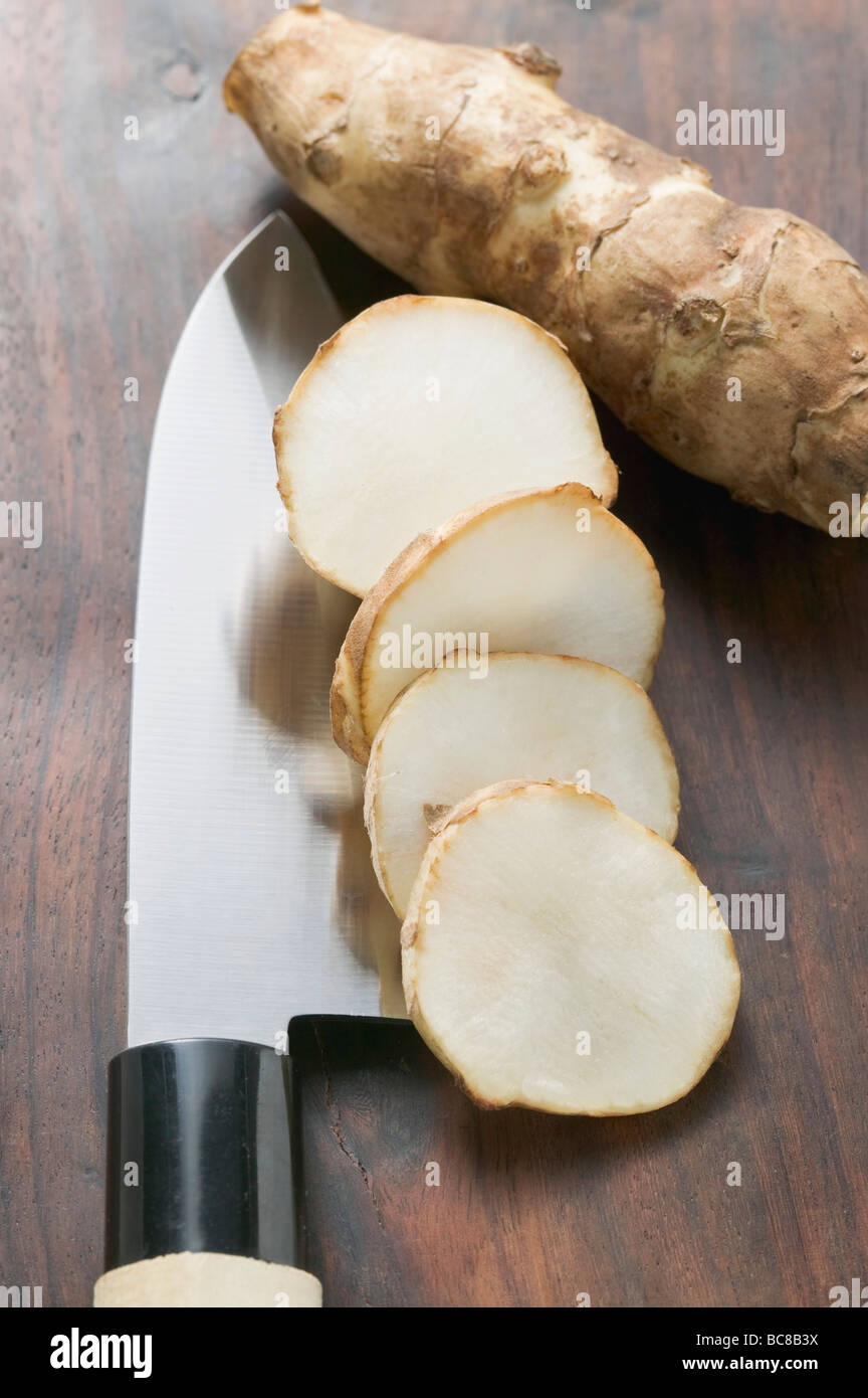 Fresh ginger root, whole and sliced Stock Photo Alamy