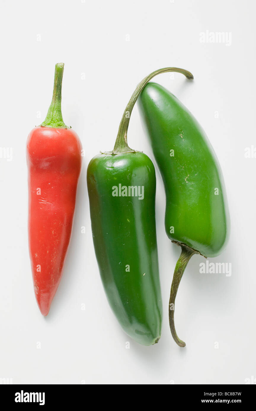 One red and two green chillies - Stock Photo