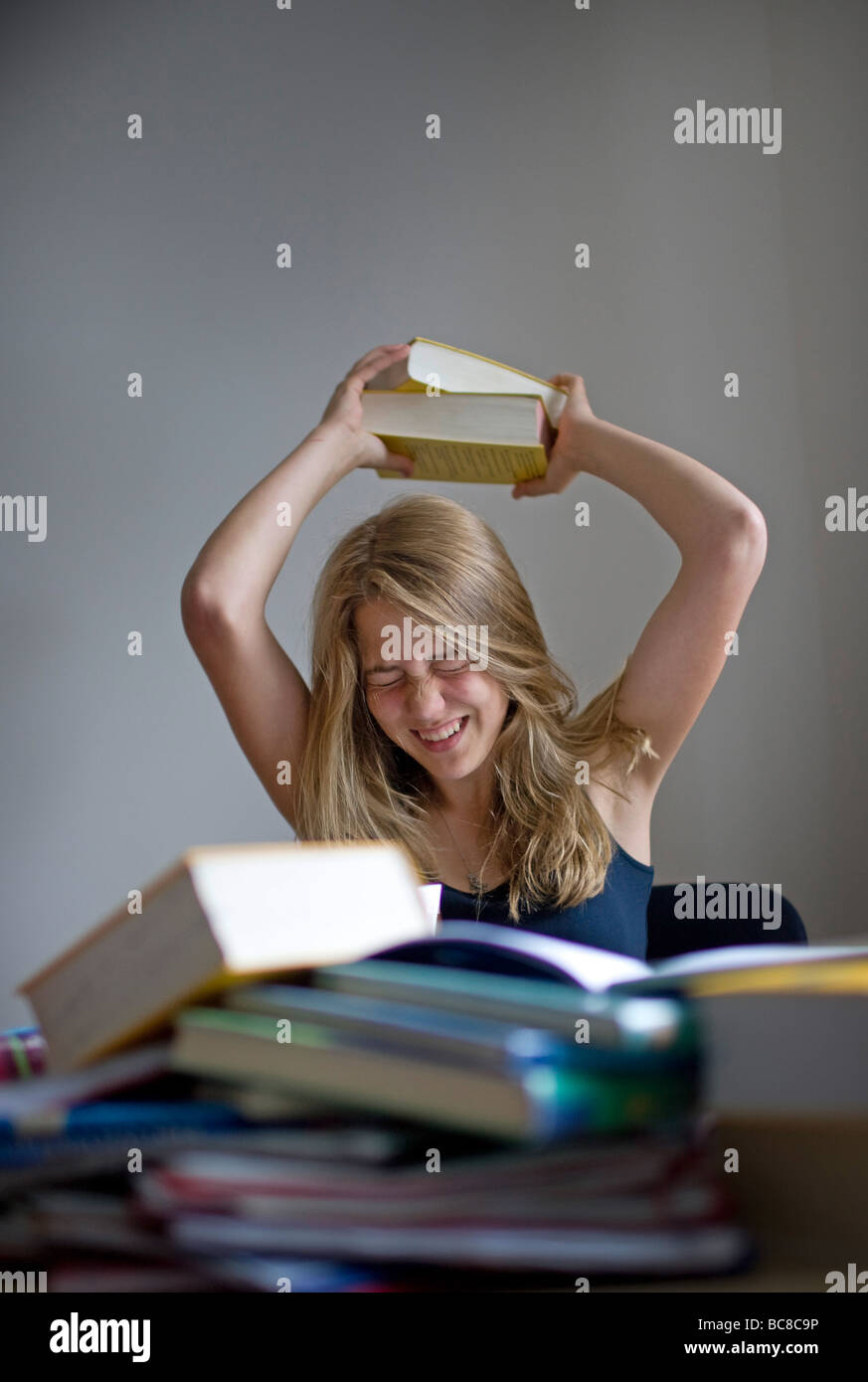a teenager is doing her homework Stock Photo