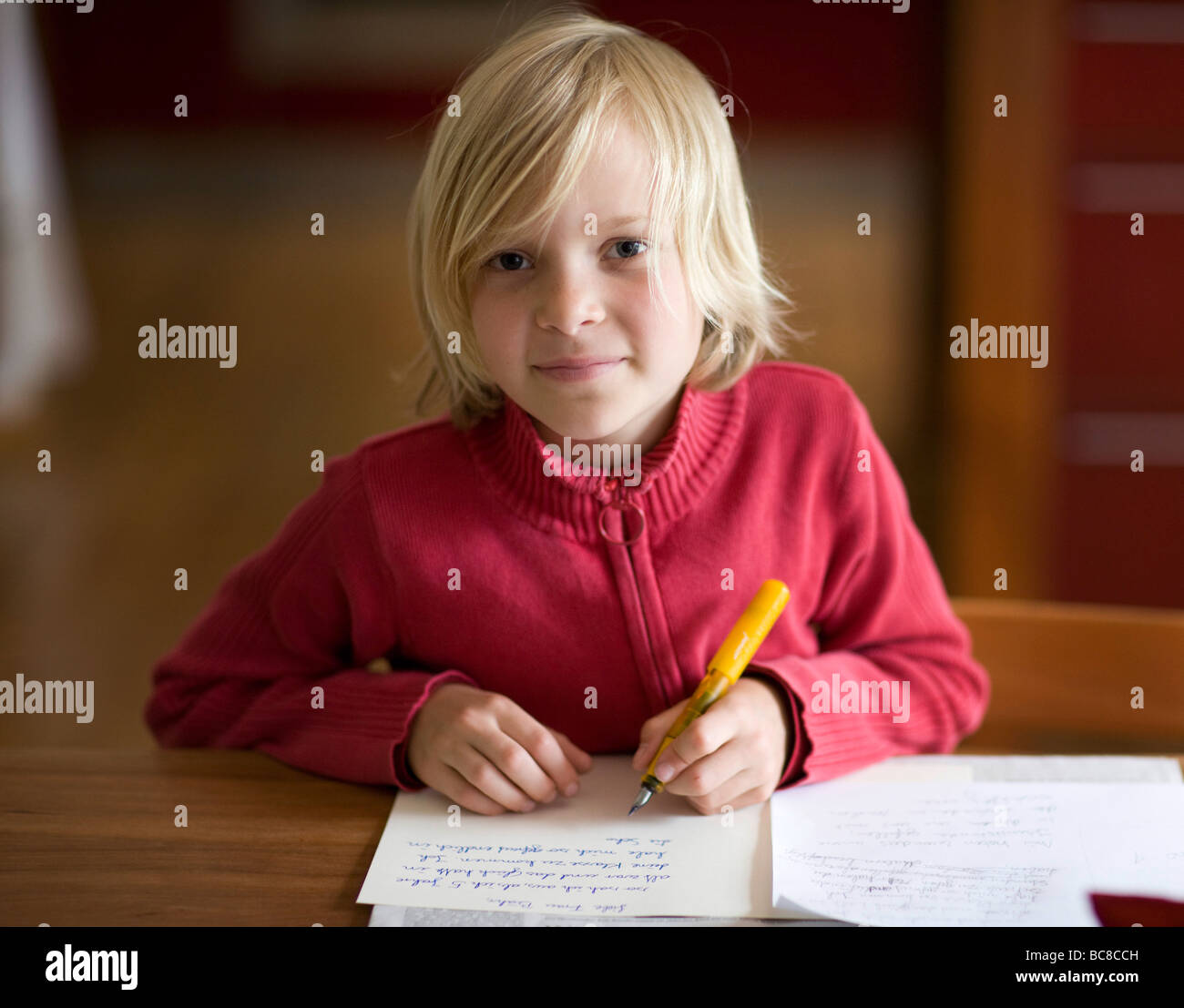 a girl is doing her homework Stock Photo