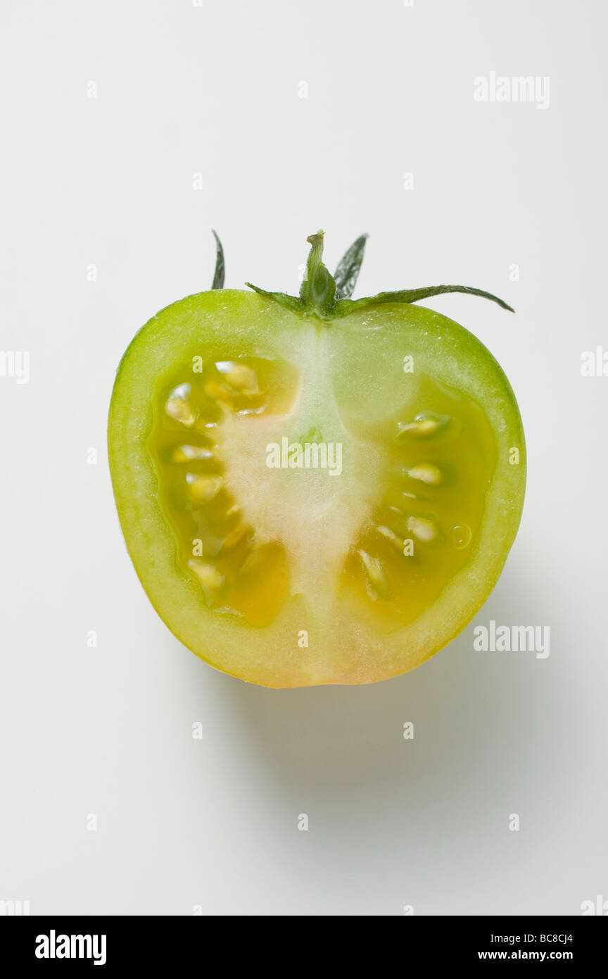 Half a green tomato (overhead view) - Stock Photo