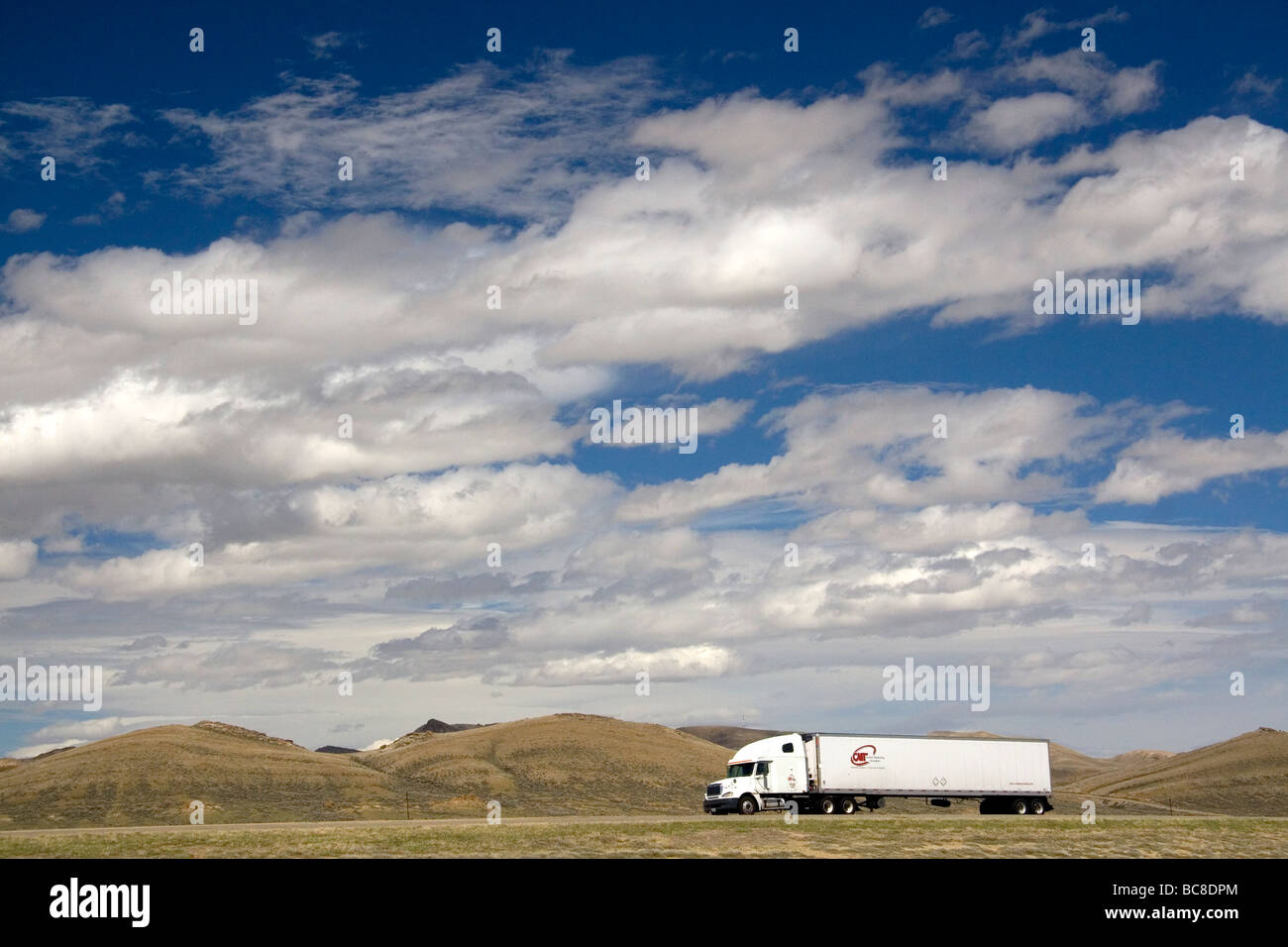 Long haul truck traveling on Interstate 80 in Carbon County Wyoming USA  Stock Photo