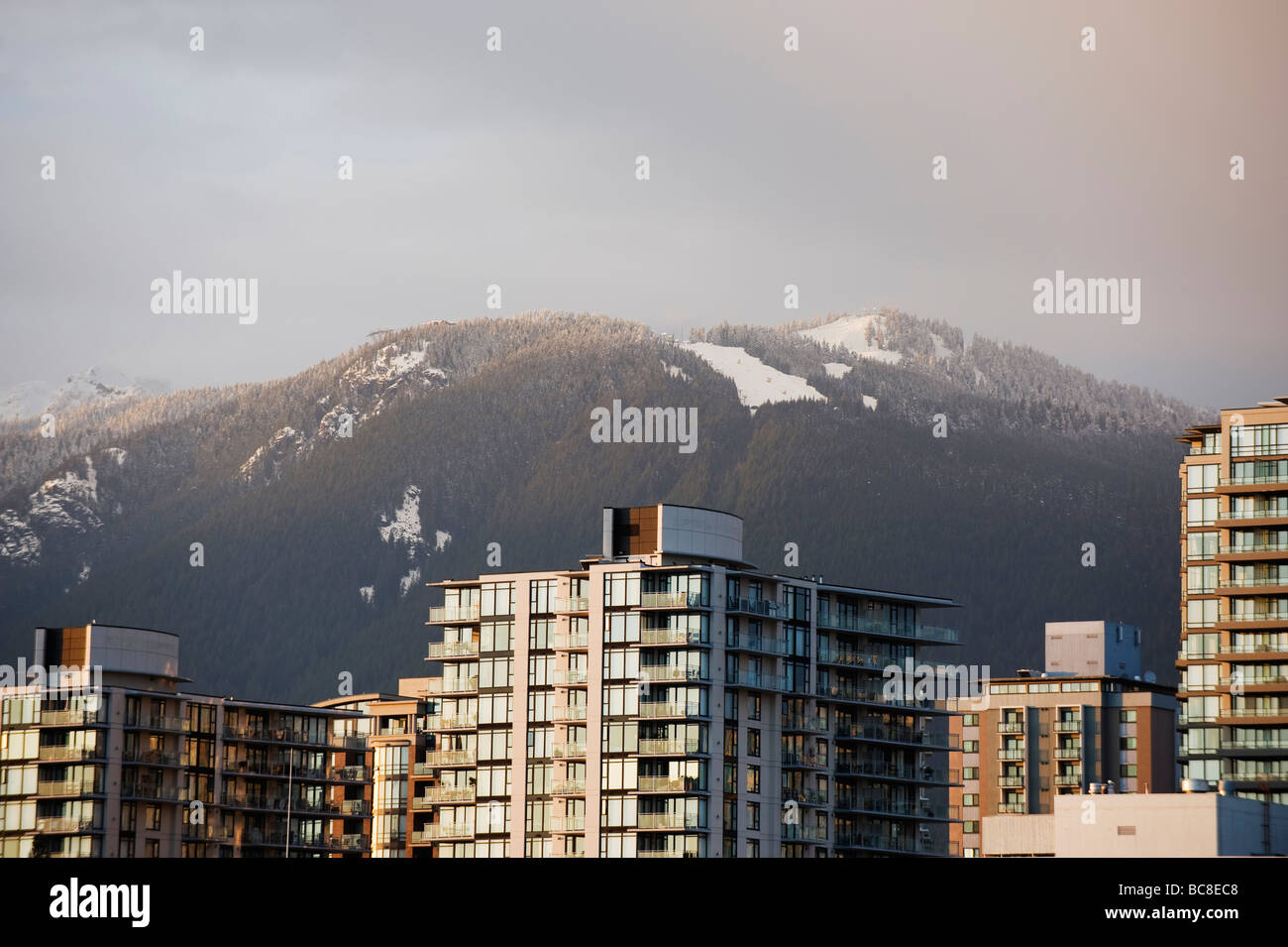 city skyline and Grouse Mountain ski resort above Vancouver British Columbia Canada Stock Photo