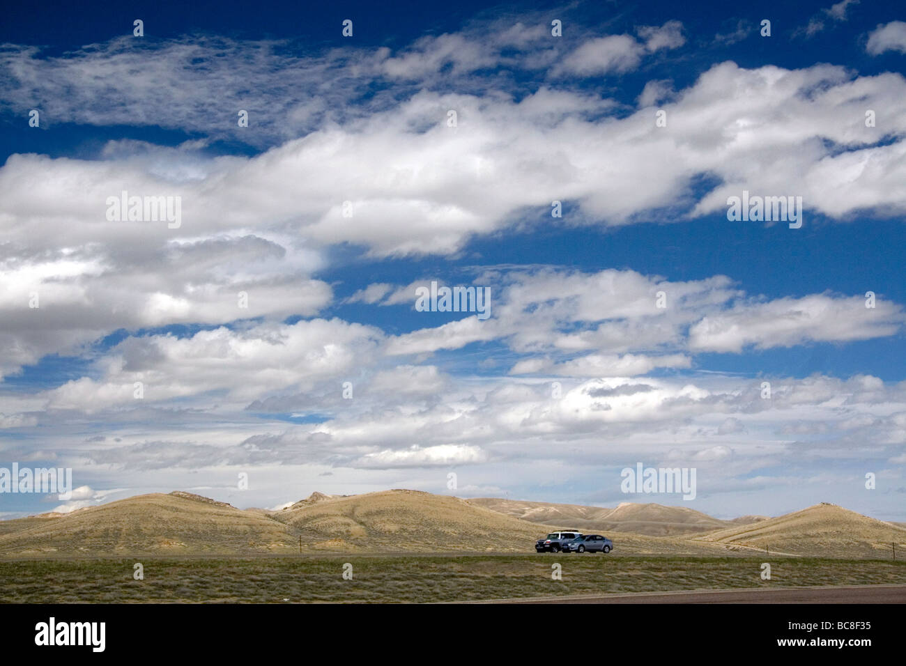 Automobiles traveling along Interstate 80 in Carbon County Wyoming USA Stock Photo