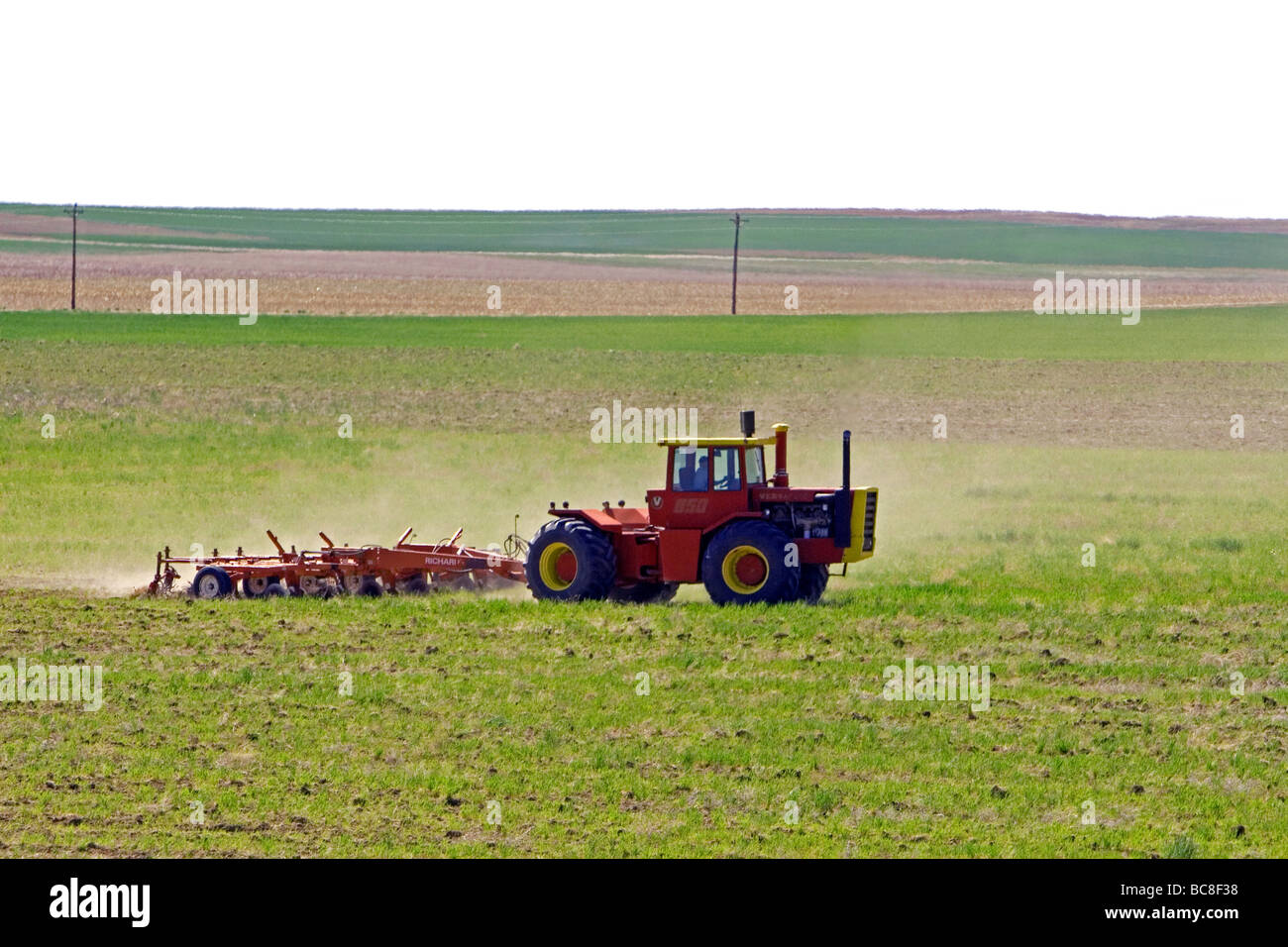 Tractor tilling spring crops at Seibert Colorado USA Stock Photo