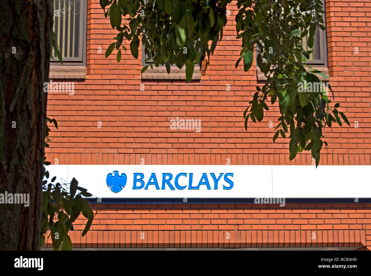 barclays bank name and logo on a redbrick wall, in hounslow high street, middlesex, england Stock Photo